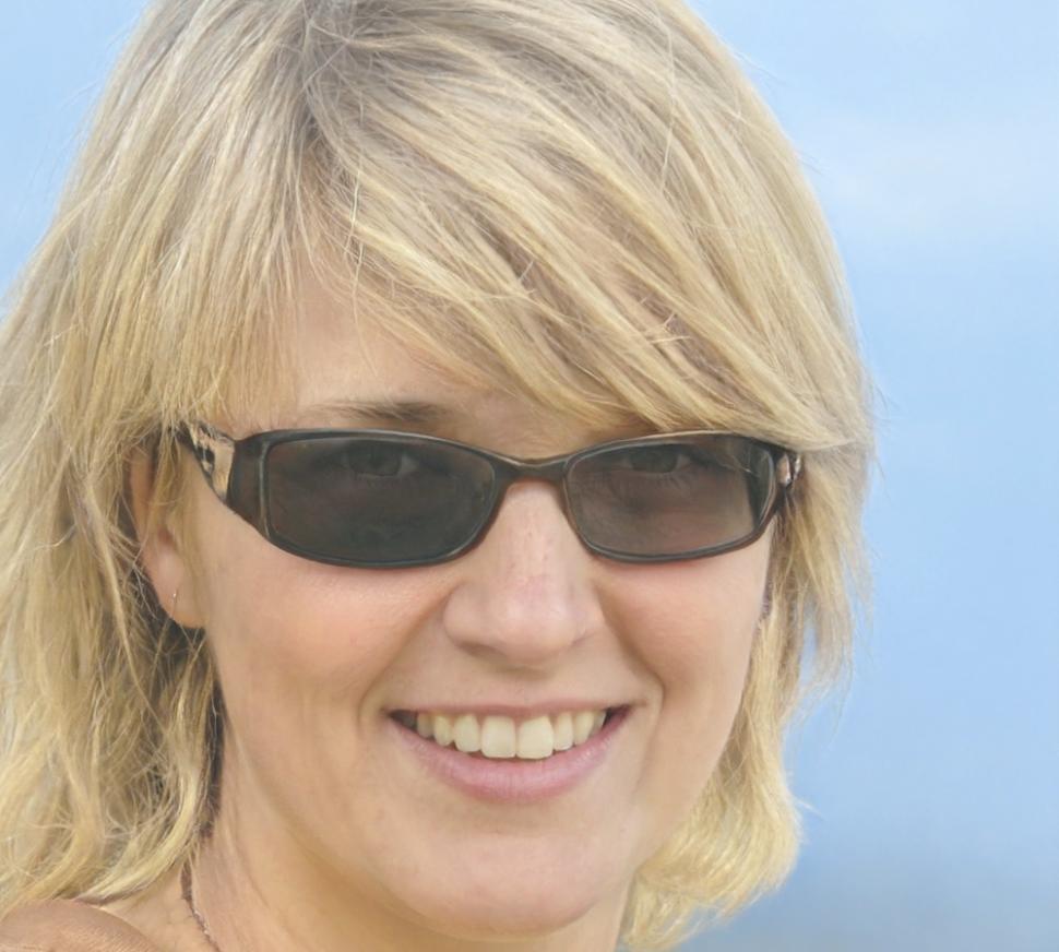 Senior financial analyst reviewing investment research and market data